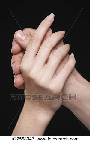 Young couple holding hands arms raised together close-up of hands View Large Photo Image Stock Image - Young couple holding hands arms raised together close-up of hands. Fotosearch