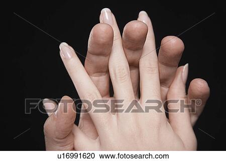 Young couple with fingers interlocked close-up of hands View Large Photo Image Stock Image - Young couple with fingers interlocked close-up of hands. Fotosearch