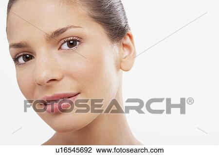 Young Woman head tilted View Large Photo Image Stock Image - Young Woman head tilted. Fotosearch