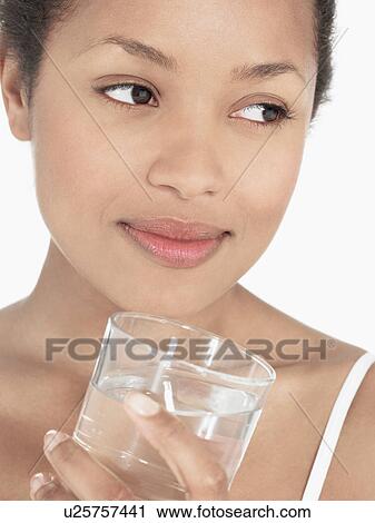 Young Woman holding glass of Water close up View Large Photo Image Stock Image - Young Woman holding glass of Water close up. Fotosearch