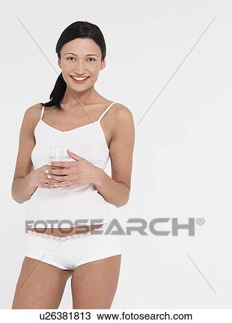 Young Woman in underwear Drinking glass of Water portrait View Large Photo Image Stock Image - Young Woman in underwear Drinking glass of Water portrait. Fotosearch