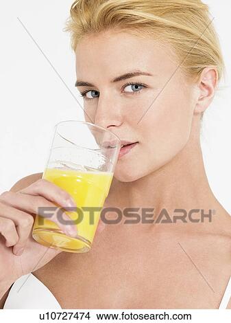 Young Woman in underwear Drinking Orange Juice portrait View Large Photo Image Picture - Young Woman in underwear Drinking Orange Juice portrait. Fotosearch