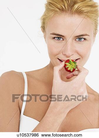 Young Woman in underwear Eating Strawberry portrait View Large Photo Image Stock Photograph - Young Woman in underwear Eating Strawberry portrait. Fotosearch