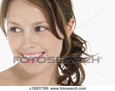 Stock Photo - Young Woman Smiling close up head shot. Fotosearch