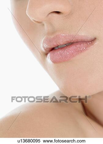 Stock Photography - Young Woman Wearing Pink Lipstick close up of mouth. Fotosearch