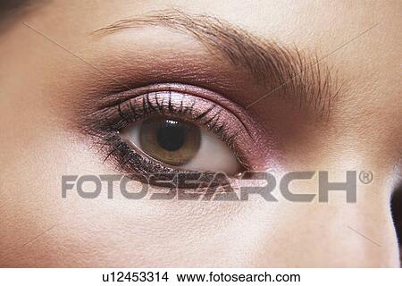 Young woman's eye with eye shadow View Large Photo Image Picture - Young woman's eye with eye shadow. Fotosearch