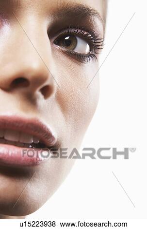 Stock Photo - Young woman's face cropped. Fotosearch