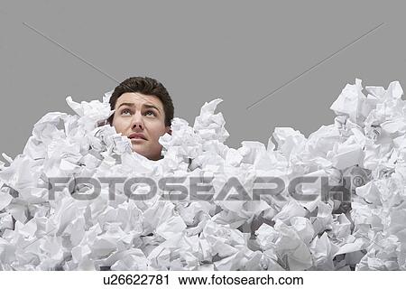 Adult man covered in crumpled paper looking up View Large Photo Image Stock Image - Adult man covered in crumpled paper looking up. Fotosearch