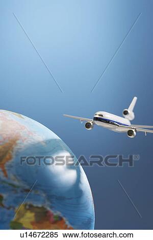 Aeroplane toy next to globe studio shot View Large Photo Image Stock Photography - Aeroplane toy next to globe studio shot. Fotosearch