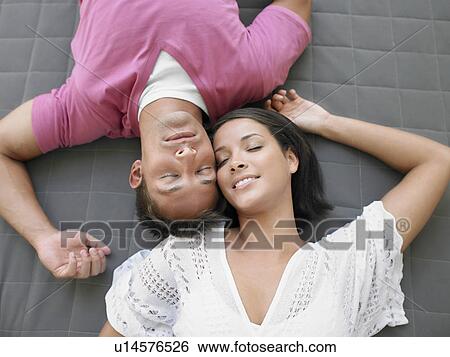 Affectionate Young Couple Lying Down View Large Photo Image Stock Photograph - Affectionate Young Couple Lying Down. Fotosearch