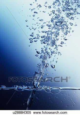 Stock Photography - Air Bubbles Shooting Upward Through Water. Fotosearch