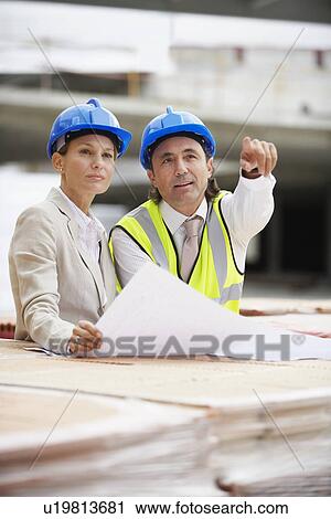 Architect and construction manager having consultation View Large Photo Image Stock Image - Architect and construction manager having consultation. Fotosearch