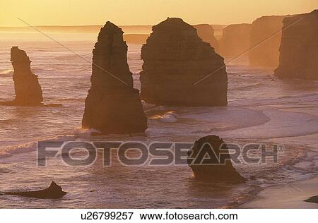 Stock Photo - Australia Victoria Great Ocean Road Twelve Apostles at sunset. Fotosearch