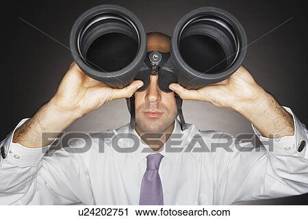 Balding Middle-aged businessman looking through large binoculars View Large Photo Image Stock Image - Balding Middle-aged businessman looking through large binoculars. Fotosearch