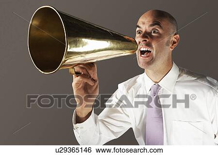 Balding Middle-aged businessman shouting through megaphone View Large Photo Image Stock Photograph - Balding Middle-aged businessman shouting through megaphone. Fotosearch
