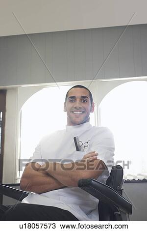 Barber sitting in barber shop portrait View Large Photo Image Stock Image - Barber sitting in barber shop portrait. Fotosearch