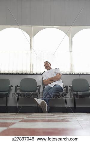 Barber sitting in barber shop portrait View Large Photo Image Stock Photograph - Barber sitting in barber shop portrait. Fotosearch