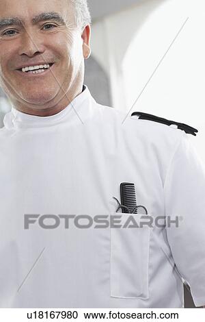 Barber with comb and scissors in pocket portrait View Large Photo Image Stock Image - Barber with comb and scissors in pocket portrait. Fotosearch