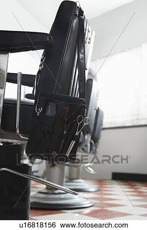 Stock Photograph - Barbers chairs in a row. Fotosearch