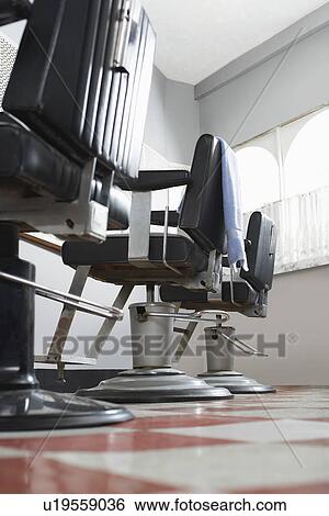 Barbers chairs in a row View Large Photo Image Stock Photograph - Barbers chairs in a row. Fotosearch