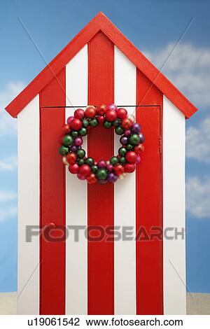 Beach storage cabin with christmas decoration on door View Large Photo Image Stock Image - Beach storage cabin with christmas decoration on door. Fotosearch