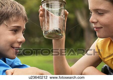 Boys Looking at Snake in Jar View Large Photo Image Stock Image - Boys Looking at Snake in Jar. Fotosearch