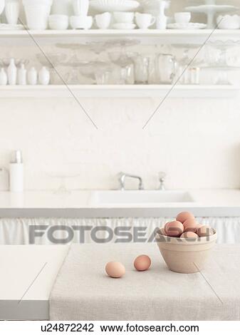 Stock Image - Brown Eggs in Bowl in White Kitchen. Fotosearch