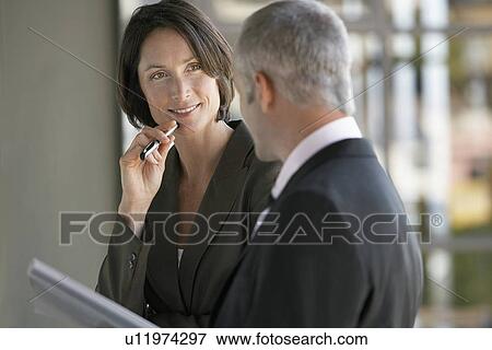 Businessman and woman talking. View Large Photo Image Stock Photo - Businessman and woman talking.. Fotosearch