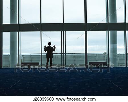 Businessman standing Looking out Window back view View Large Photo Image Stock Image - Businessman standing Looking out Window back view. Fotosearch