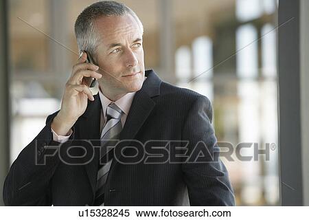Businessman Using mobile phone. View Large Photo Image Stock Photography - Businessman Using mobile phone.. Fotosearch