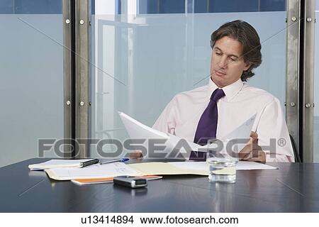 Picture - Businessman working in office. Fotosearch