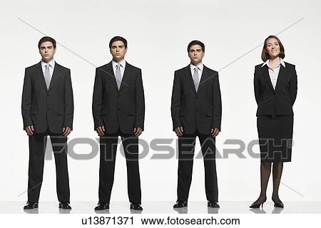 Businesspeople standing side by side arms by side behind back View Large Photo Image Stock Image - Businesspeople standing side by side arms by side behind back. Fotosearch