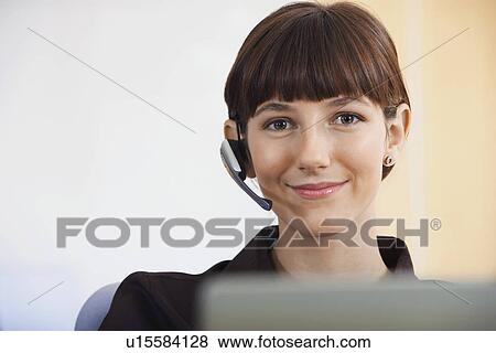 Businesswoman wearing telephone headset portrait View Large Photo Image Stock Photo - Businesswoman wearing telephone headset portrait. Fotosearch