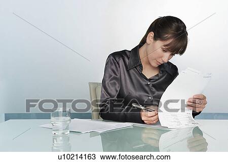 Stock Image - Businesswoman working. Fotosearch