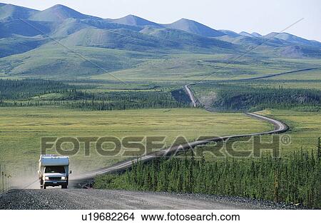 Picture - Camper van on rural road. Fotosearch