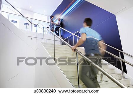 Casually dressed Businessman Walking Up Stairs side view View Large Photo Image Stock Image - Casually dressed Businessman Walking Up Stairs side view. Fotosearch