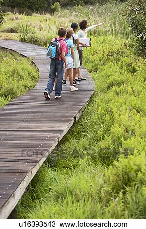 Stock Image - Children on Nature Field Trip. Fotosearch