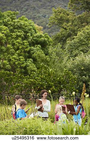 Stock Photograph - Children on Nature Field Trip. Fotosearch