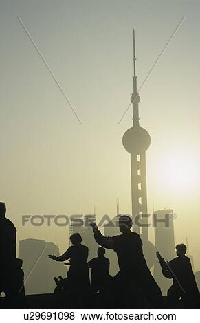 China Shanghai silhouettes of people against city skyline (Oriental Pearl TV Tower) View Large Photo Image Stock Photo - China Shanghai silhouettes of people against city skyline (Oriental Pearl TV Tower). Fotosearch