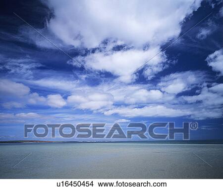 Picture - Clouds over ocean. Fotosearch