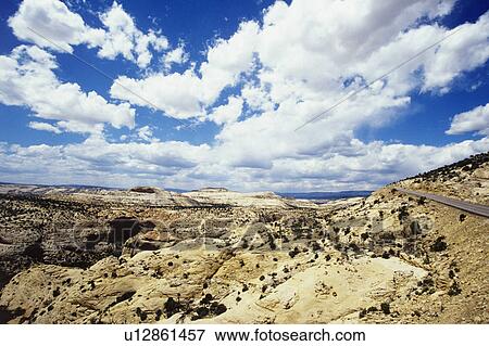 Cloudscape above rocky landscape View Large Photo Image Stock Photo - Cloudscape above rocky landscape. Fotosearch