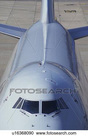 Stock Image - Commercial Airplane on tarmac at airport. Fotosearch