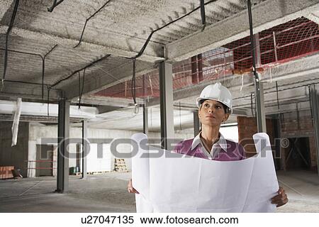 Construction manager at construction site View Large Photo Image Stock Photography - Construction manager at construction site. Fotosearch