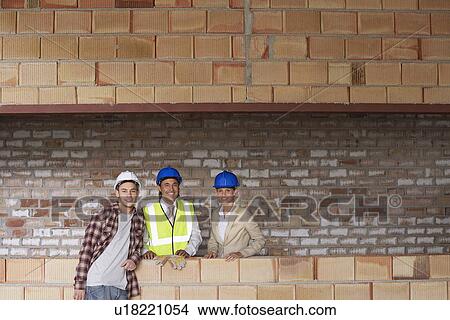 Picture - Construction team on building site. Fotosearch