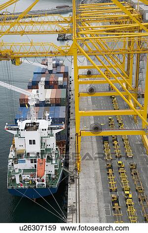 Stock Photo - Container ship in docks elevated view. Fotosearch