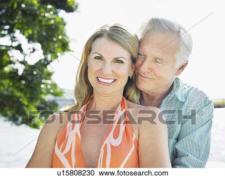 Couple cheek to cheek outdoors portrait View Large Photo Image Stock Image - Couple cheek to cheek outdoors portrait. Fotosearch