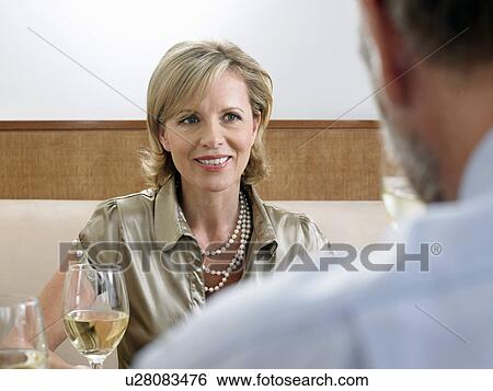 Couple drinking wine in restaurant View Large Photo Image Stock Photograph - Couple drinking wine in restaurant. Fotosearch