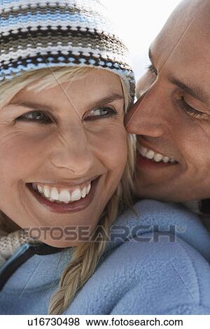 Couple embracing on mountain peak close-up portrait View Large Photo Image Stock Photo - Couple embracing on mountain peak close-up portrait. Fotosearch