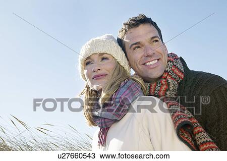 Couple embracing outdoors View Large Photo Image Stock Image - Couple embracing outdoors. Fotosearch