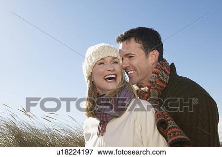 Stock Photo - Couple embracing outdoors. Fotosearch